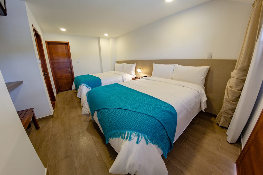 Cama doble y cama queen suite deluxe hotel san marcos Chiquinquirá